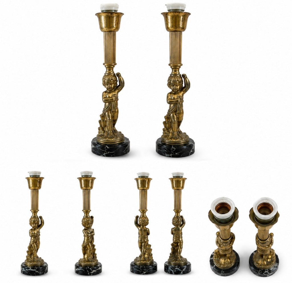 Paire de lampes anciennes à chérubins sur socle en marbre noir
